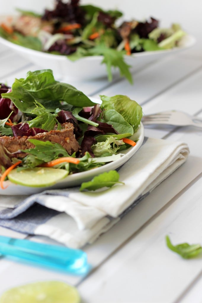 Thai beef salad - A colorful Thai beef salad packed with flavors of fish sauce, shallots, lime juice, mint, cilantro, lemongrass, cucumbers, carrots and wonderful garnishes.