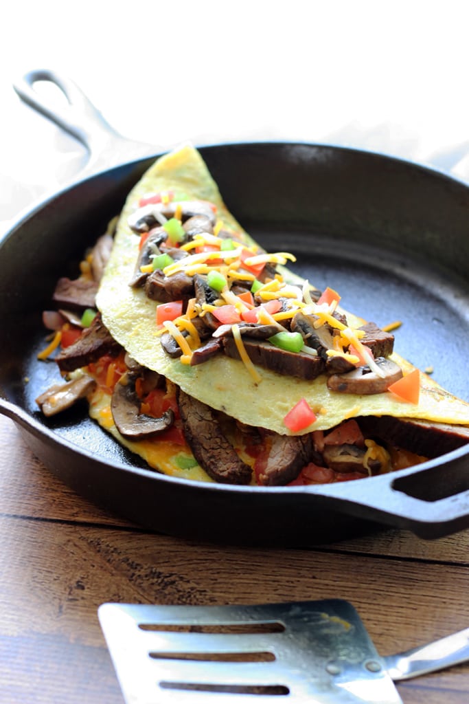 An IHOP copycat recipe for Big Steak Omelette: a giant omelette stuffed to the brim with steak, bell peppers, onions, cheese, hash browns and mushrooms!