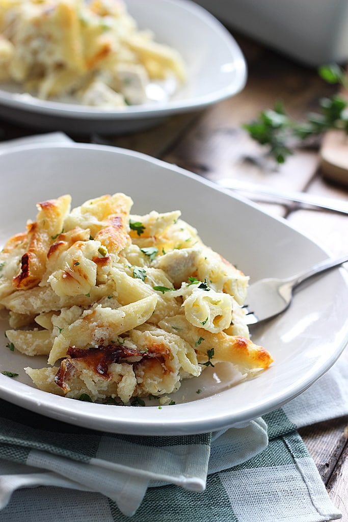 Creamy, cheesy packed chicken Alfredo pasta bake with three kinds of cheese and plenty to go around. Lots of gooey, stringy cheese in this fall casserole!