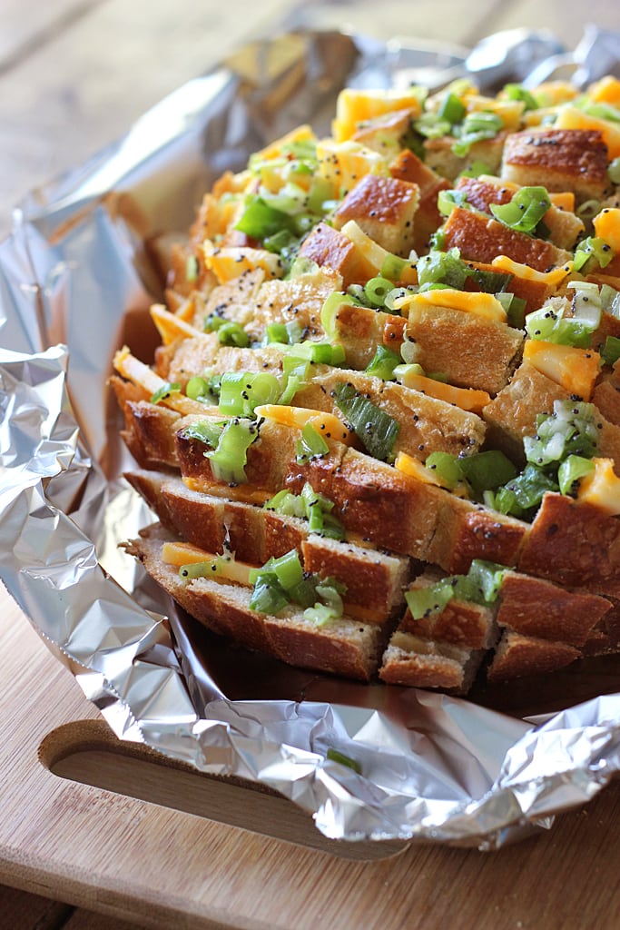 Bloomin' onion bread is the appetizer you're looking for to 'wow' guests. Cheesy, gooey strings of cheese meets crunchy, fresh green onions and poppy seeds!