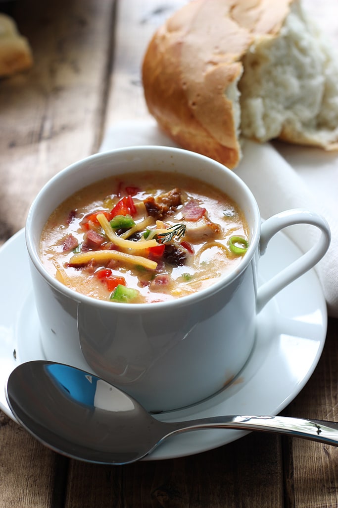 Creamy spicy chicken and corn chowder is the perfect soup for fall. With rotisserie chicken, corn, bacon, jalapenos, bell peppers and cheddar cheese.