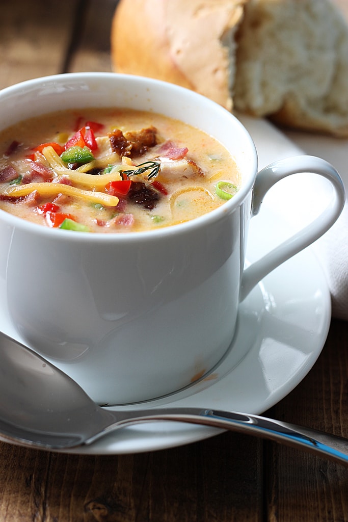 Creamy spicy chicken and corn chowder is the perfect soup for fall. With rotisserie chicken, corn, bacon, jalapenos, bell peppers and cheddar cheese.