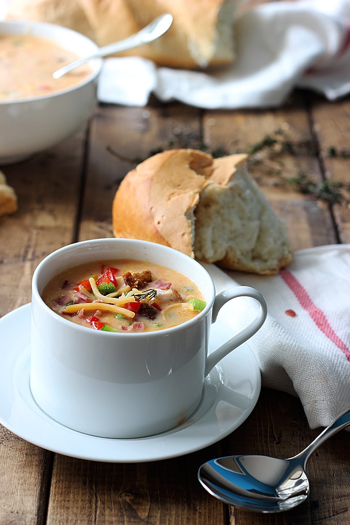 Creamy spicy chicken and corn chowder is the perfect soup for fall. With rotisserie chicken, corn, bacon, jalapenos, bell peppers and cheddar cheese.