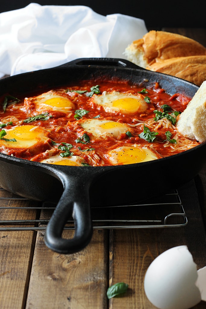 Eggs in Hell are a quick and spicy way to enjoy your eggs in the morning. With plenty of spices, Parmesan cheese and eggs simmered in tomato sauce.