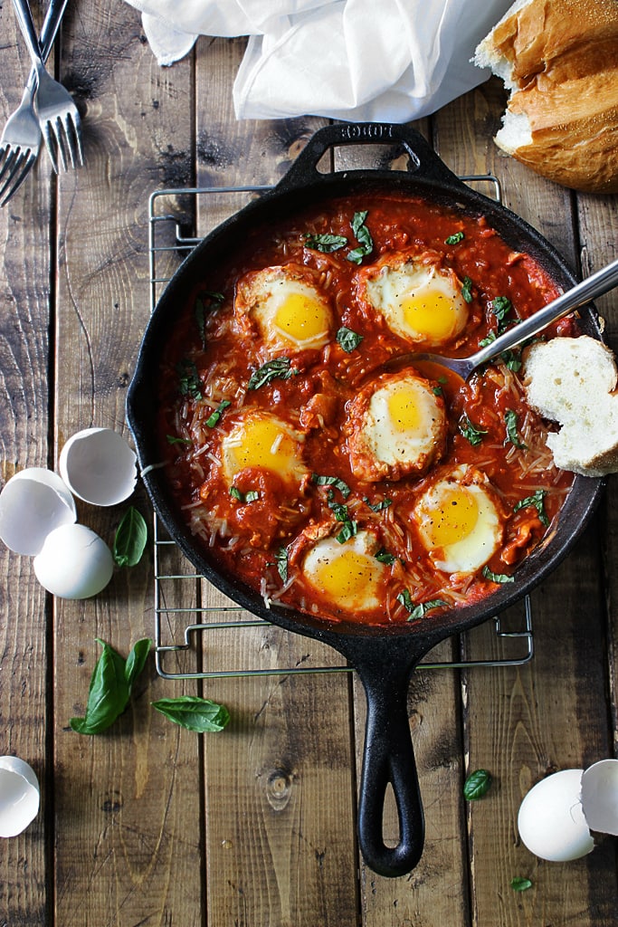 Eggs in Hell are a quick and spicy way to enjoy your eggs in the morning. With plenty of spices, Parmesan cheese and eggs simmered in tomato sauce.