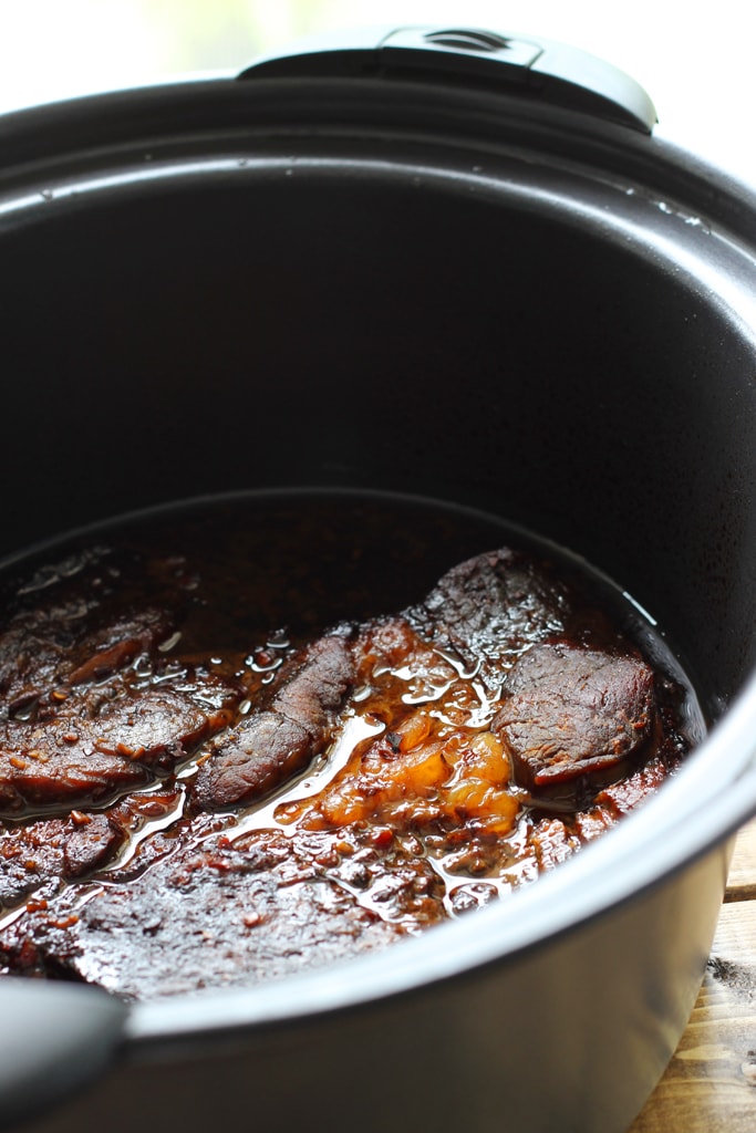 Slow cooker balsamic roast only needs 15 minutes of preparation. Brown sugar balances out the balsamic vinegar to create a mildly sweet and savory roast.