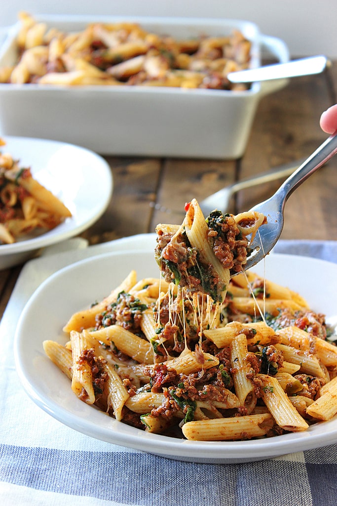 A slow cooker beef and cheese pasta that is cooked long and slow to bring out the best cheesy meat sauce!