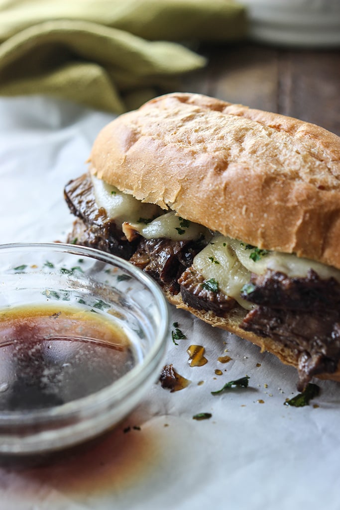 A slow cooker French Dip sandwich that's a perfect hot fix for cool weather. Dip, dip, dip it in some hearty au jus gravy!