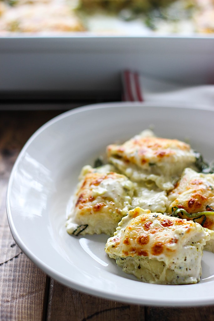 An easy, cheesy rich and creamy spinach and artichoke ravioli bake. Easy to make with convenience items from grocery stores!