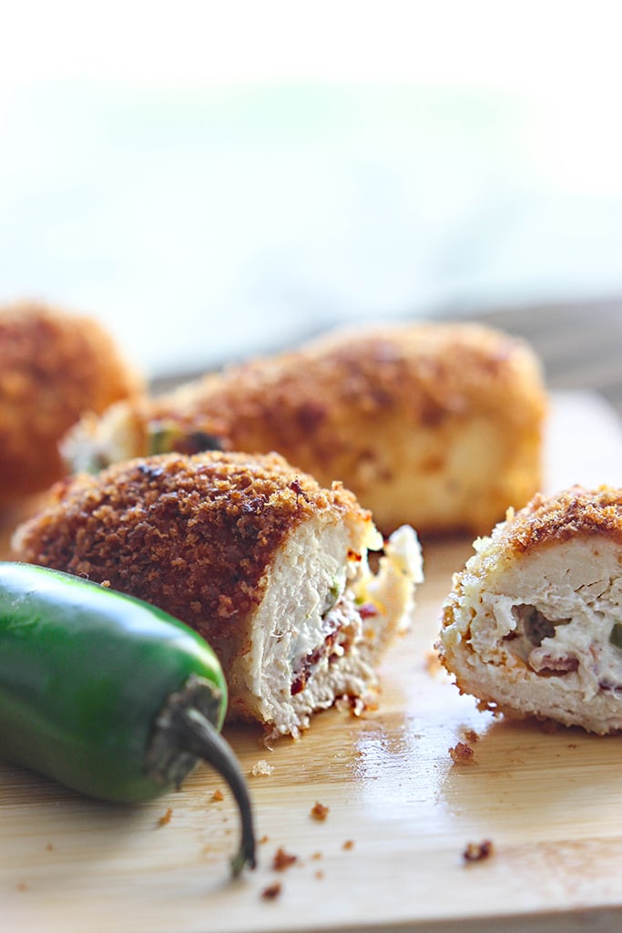 Jalapeno popper chicken is a fun way to snack with cream cheese, bacon bits and jalapenos stuffing in a crispy breaded chicken!