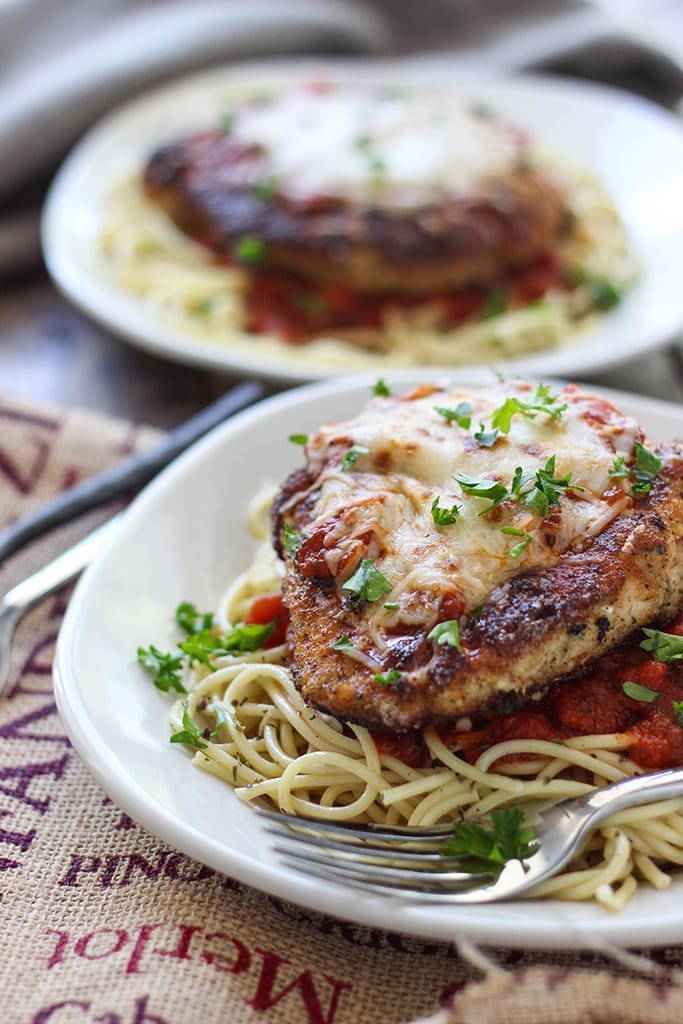 This skillet chicken Parmesan is ready under 30 minutes. With Parmesan herbed breading served with mozzarella cheese and marinara sauce.