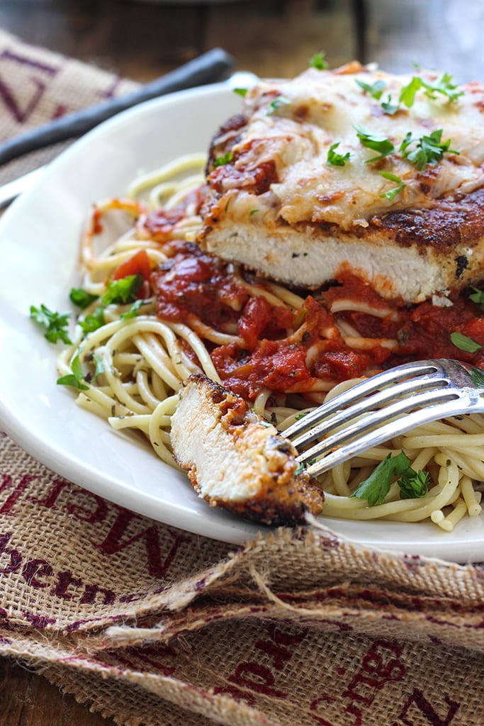 This skillet chicken Parmesan is ready under 30 minutes. With Parmesan herbed breading served with mozzarella cheese and marinara sauce.