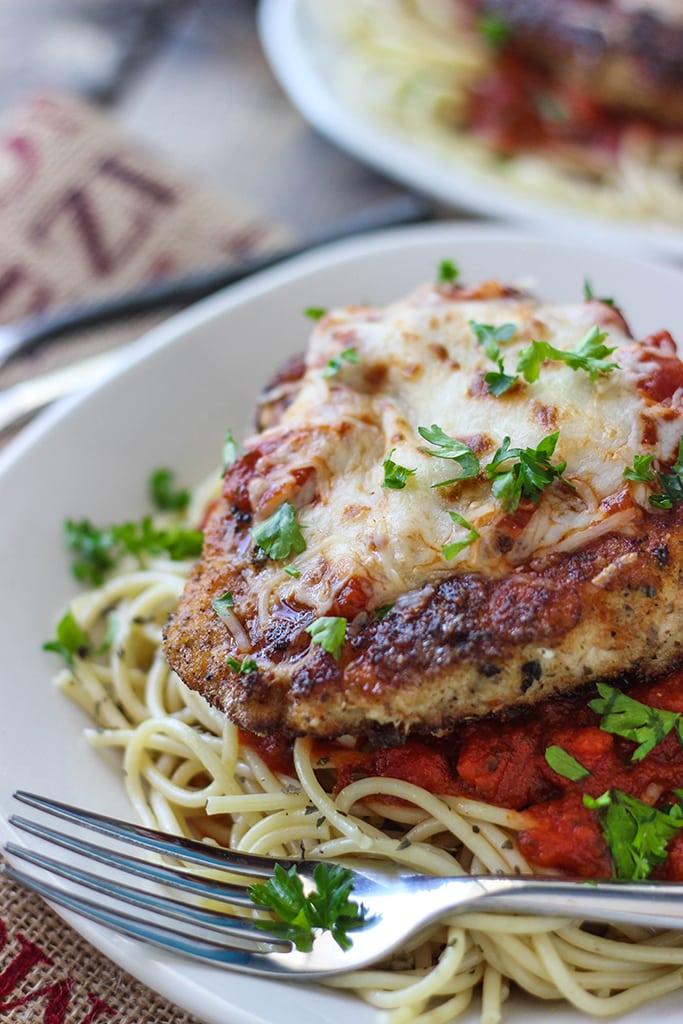 This skillet chicken Parmesan is ready under 30 minutes. With Parmesan herbed breading served with mozzarella cheese and marinara sauce.