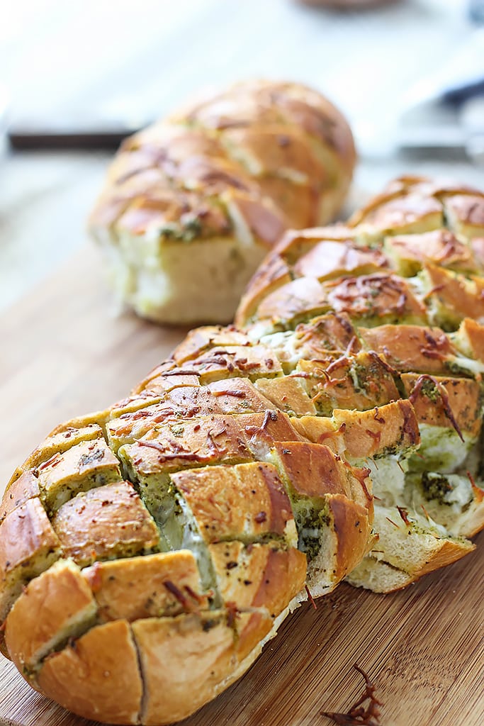 There's plenty of cheese action in this cheesy pesto pull-apart bread. Feed a crowd with this easy 4 ingredient appetizer.