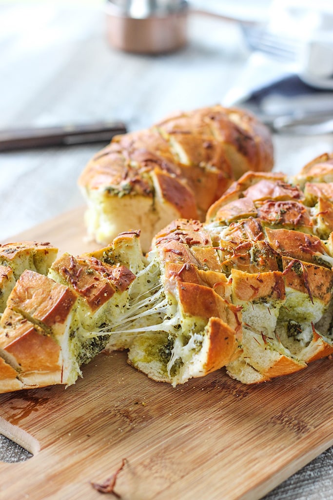 There's plenty of cheese action in this cheesy pesto pull-apart bread. Feed a crowd with this easy 4 ingredient appetizer.