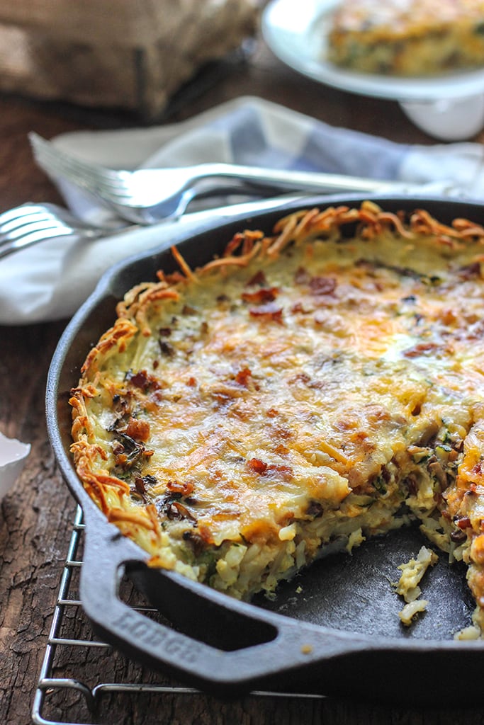 Enjoy a crispy hash brown crust in this hash brown breakfast quiche filled with custard, zucchini, mushrooms and bacon!