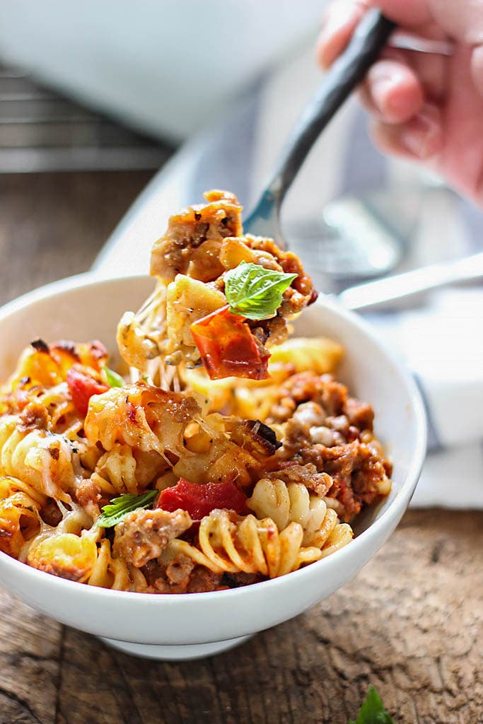 A cheesy hot Italian pasta bake with a spiced savory and sweet marinara sauce, hot Italian flavors and plenty of cheese.