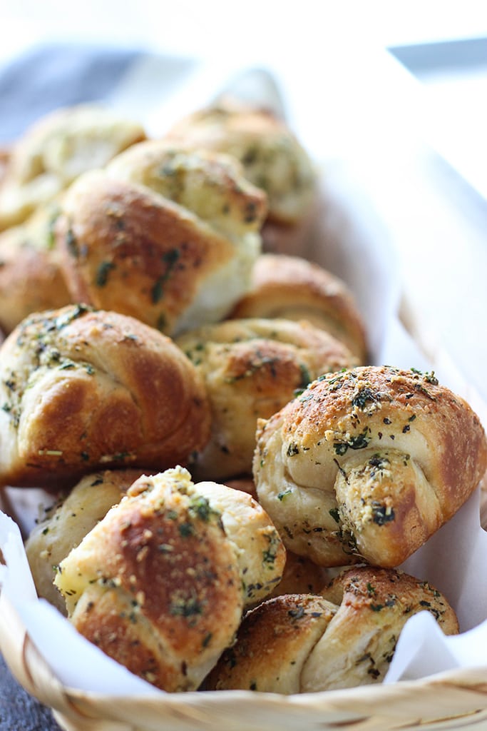 Love garlic knots? Make these easy Parmesan garlic knots at home with a simple cheat! Ready in under 30 minutes.