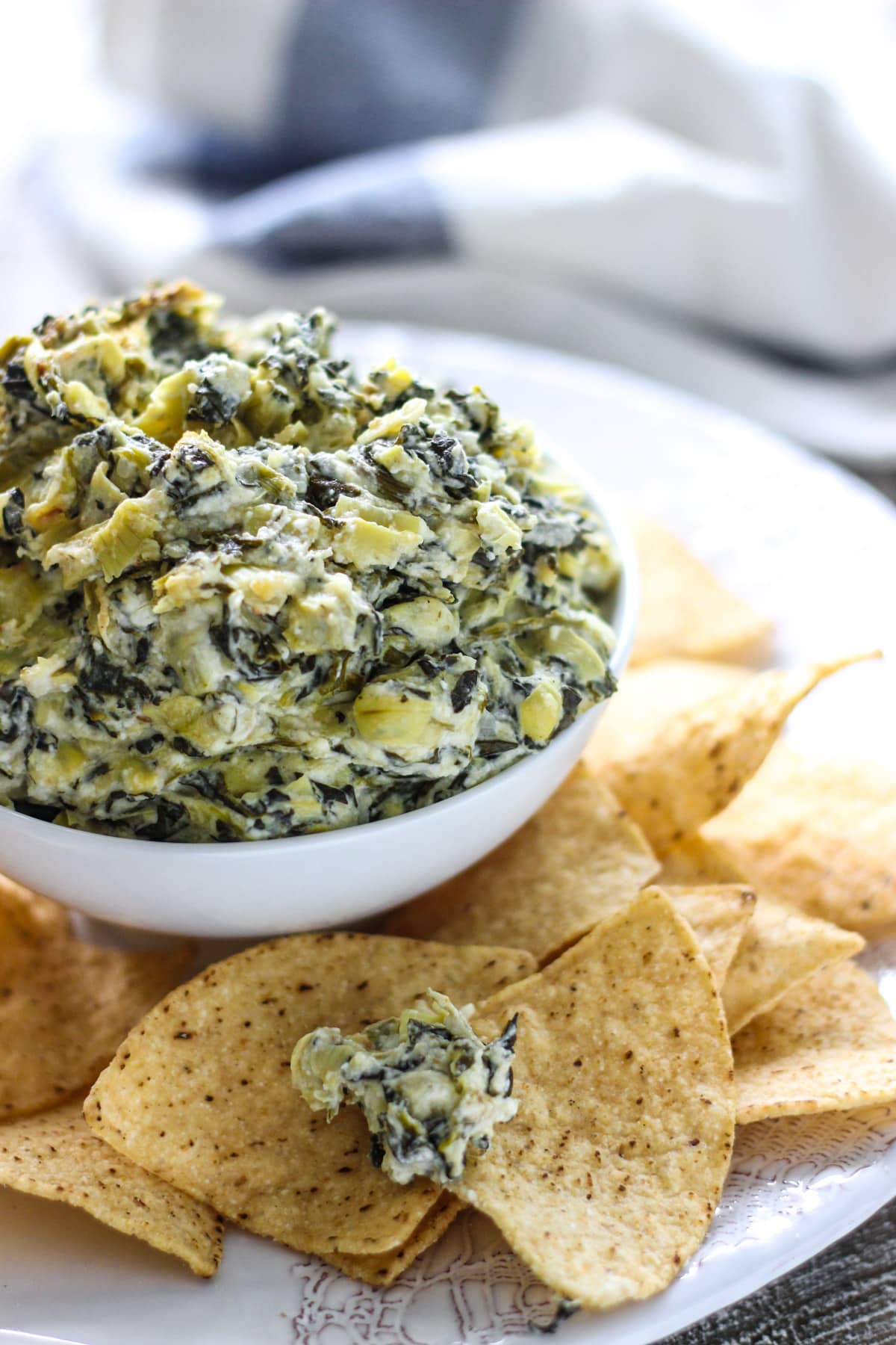 Seriously easy and seriously yummy. This homemade slow cooker spinach and artichoke dip feeds a crowd of ten!
