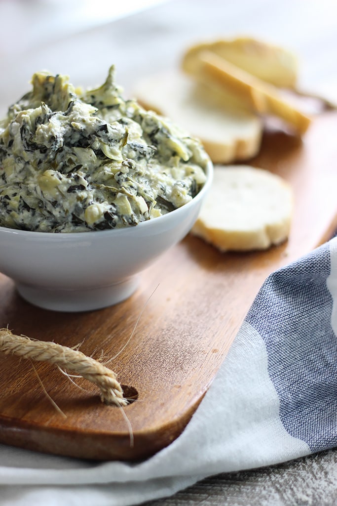 Seriously easy and seriously yummy. This homemade slow cooker spinach and artichoke dip feeds a crowd of ten!