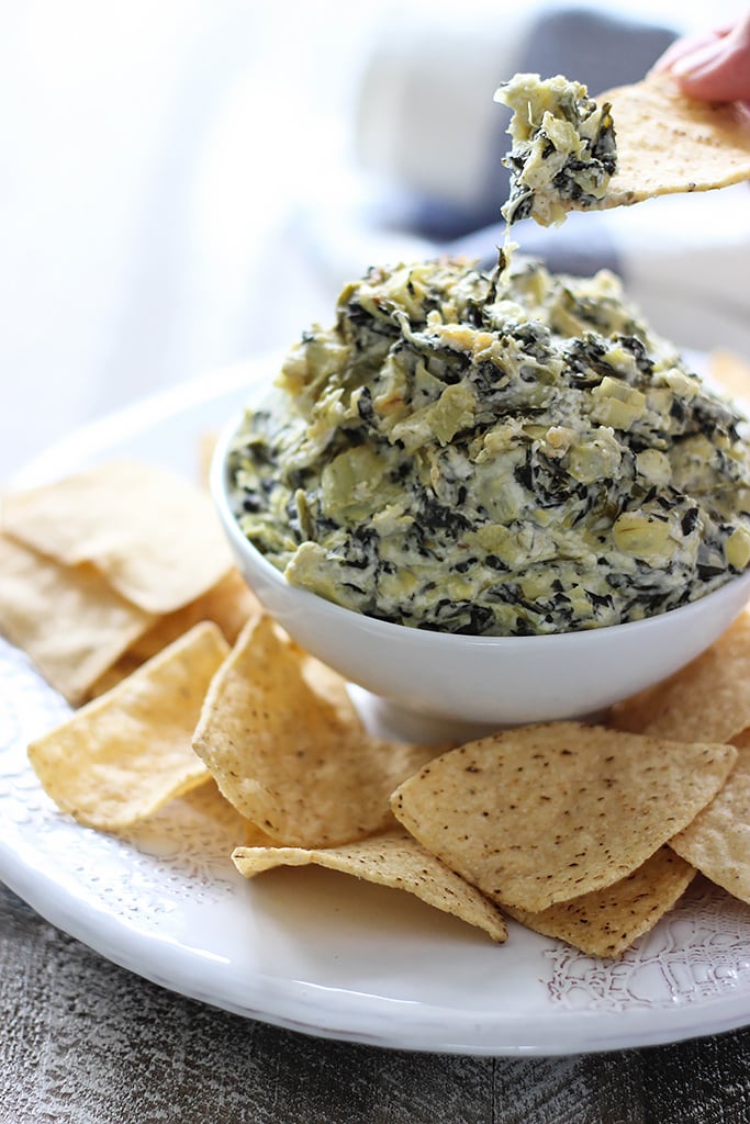 Seriously easy and seriously yummy. This homemade slow cooker spinach and artichoke dip feeds a crowd of ten!