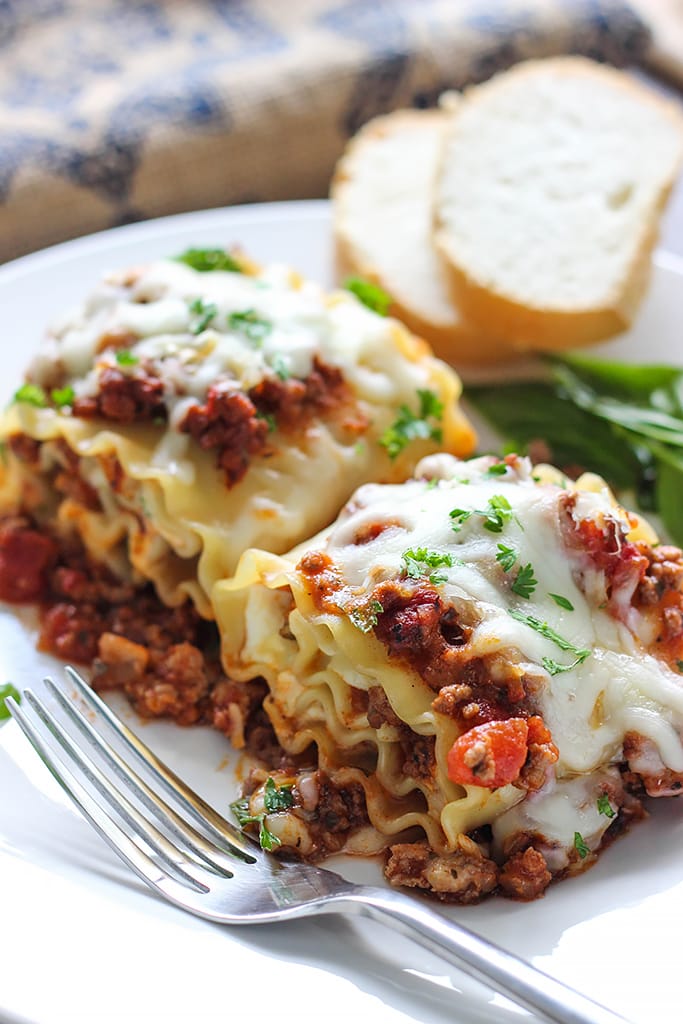 Make some individual sized meaty and cheesy lasagna roll ups. A fun twist on the classic with enough to serve a crowd. 