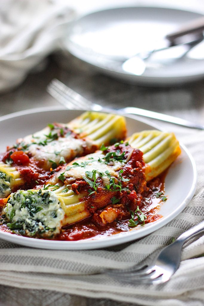 This spinach and three cheese manicotti is perfect for Italian food loving vegetarians. The perfect comfort food this fall.