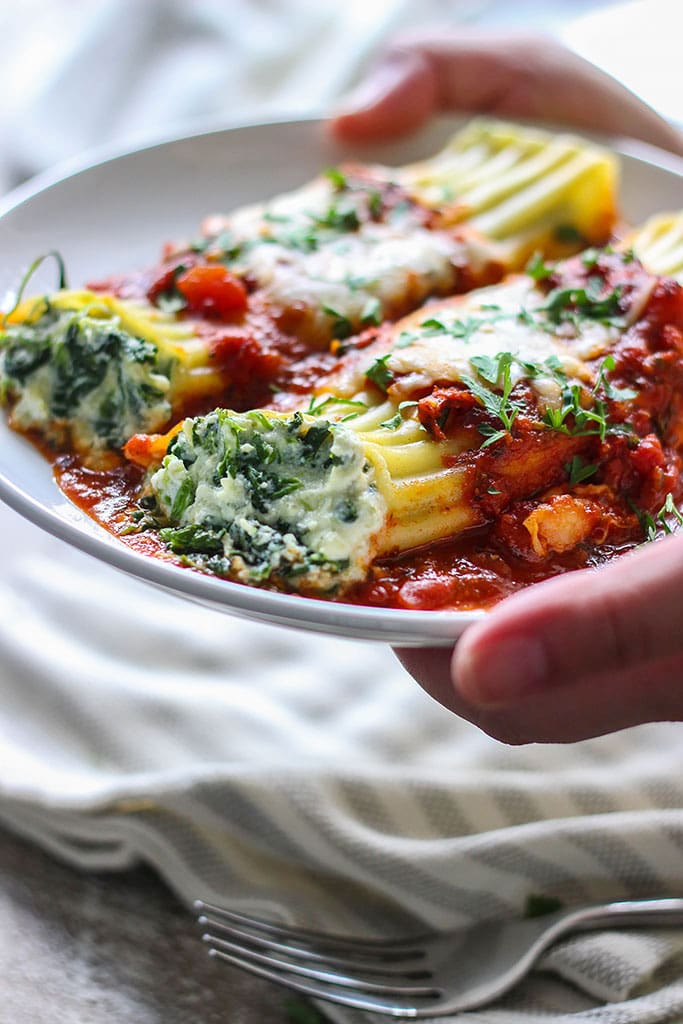 This spinach and three cheese manicotti is perfect for Italian food loving vegetarians. The perfect comfort food this fall.