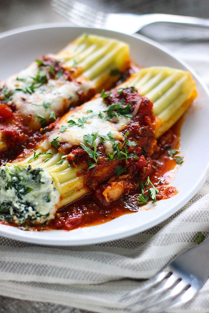 This spinach and three cheese manicotti is perfect for Italian food loving vegetarians. The perfect comfort food this fall.
