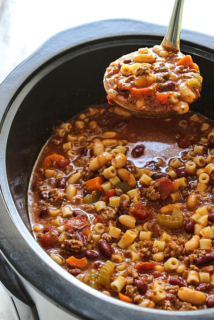 Break out the bowls for some comfort. This slow cooker beef and beans pasta soup has everything you need. Don't forget the Parmesan.