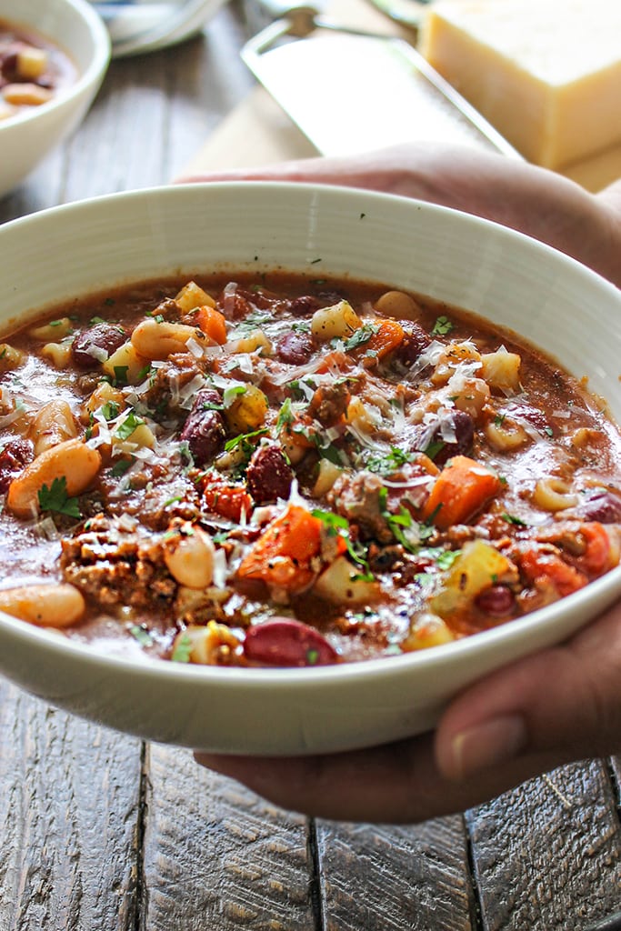 Break out the bowls for some comfort. This slow cooker beef and beans pasta soup has everything you need. Don't forget the Parmesan.