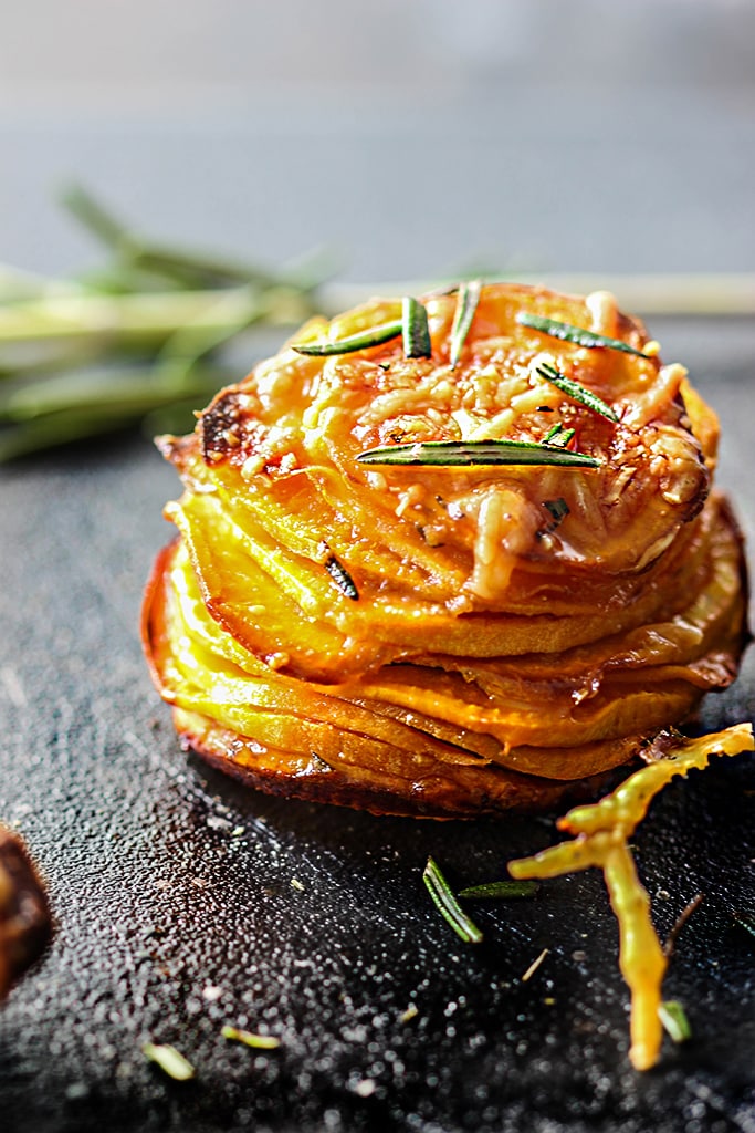 Do things differently with these garlic Parmesan sweet potato stacks. With crispy brown edges and soft tender centers, fresh rosemary, garlic, butter and Parmesan!