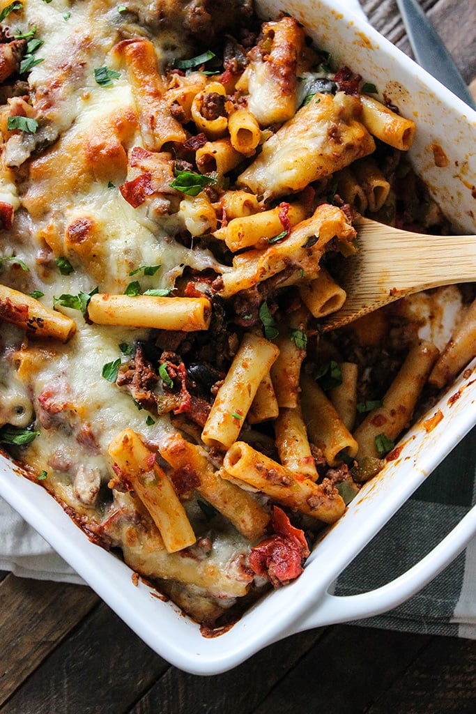 This pizza pasta casserole has all the flavors of pizza you love in casserole form. With tons of mozzarella cheese and lots of cheese strings!