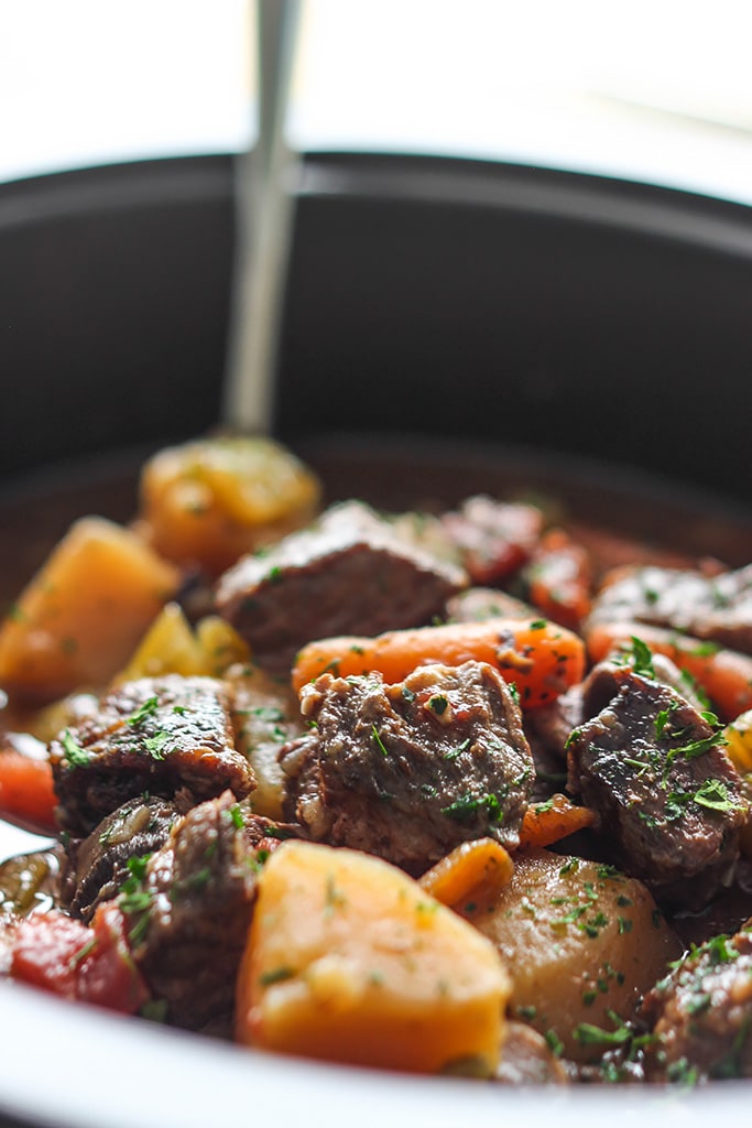 A hearty slow cooker beef stew with fall-apart, tender chuck roast, potatoes and carrots. A comforting, warm meal perfect for the cold weather.