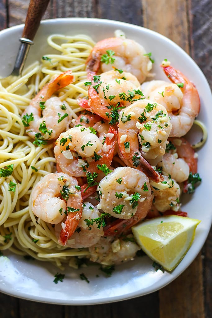 Enjoy a 20 minute meal with easy shrimp scampi; seared shrimp in a garlic buttery sauce with a hint of lemon, parsley and served over a bed of your favorite pasta.