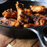 Grilled Sriracha hot wings with ginger, honey, soy sauce, lemongrass, lime juice, brown sugar and Sriracha.