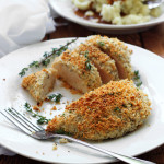 Easy baked Parmesan and herb crusted chicken breasts are baked in the oven with panko breadcrumbs, Parmesan cheese, Italian seasoning and sage.