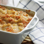 A cheesy, creamy cauliflower Au Gratin casserole with rich Bechamel sauce topped with a crusty layer of breadcrumbs and cheese.