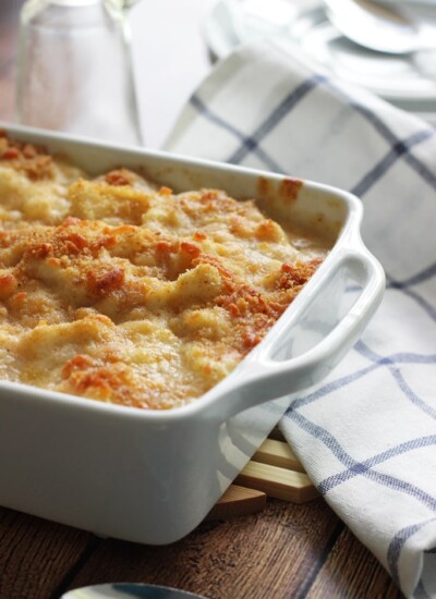 A cheesy, creamy cauliflower Au Gratin casserole with rich Bechamel sauce topped with a crusty layer of breadcrumbs and cheese.