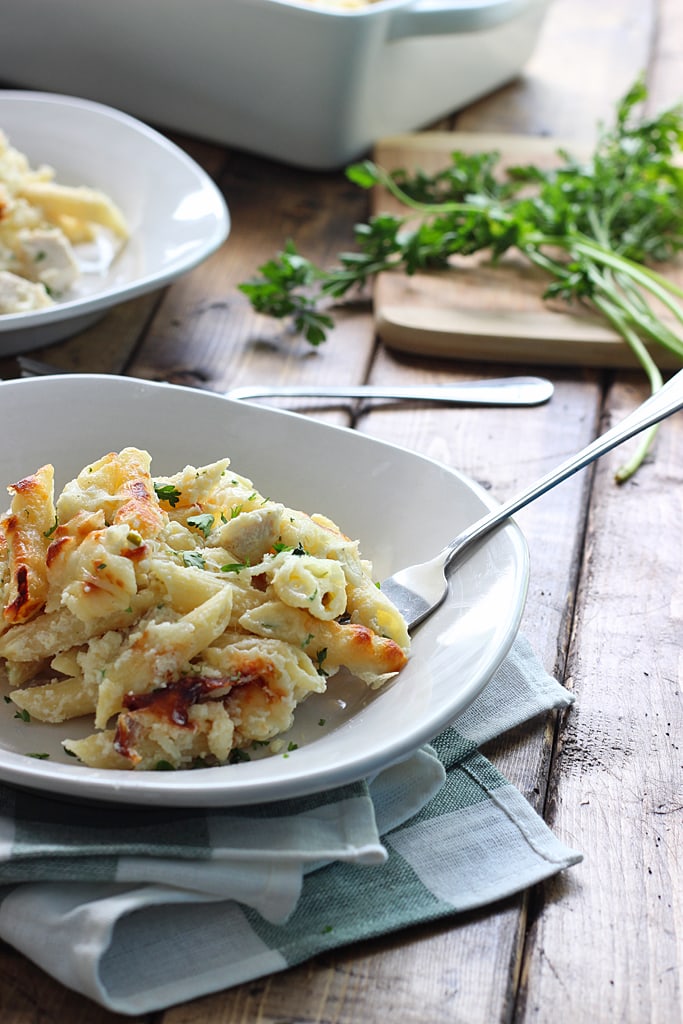 Creamy, cheesy packed chicken Alfredo pasta bake with three kinds of cheese and plenty to go around. Lots of gooey, stringy cheese in this fall casserole!