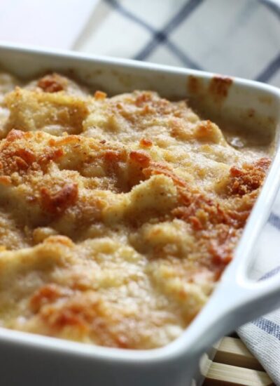 A cheesy, creamy cauliflower Au Gratin casserole with rich Bechamel sauce topped with a crusty layer of breadcrumbs and cheese.