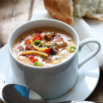 Creamy spicy chicken and corn chowder is the perfect soup for fall. With rotisserie chicken, corn, bacon, jalapenos, bell peppers and cheddar cheese.