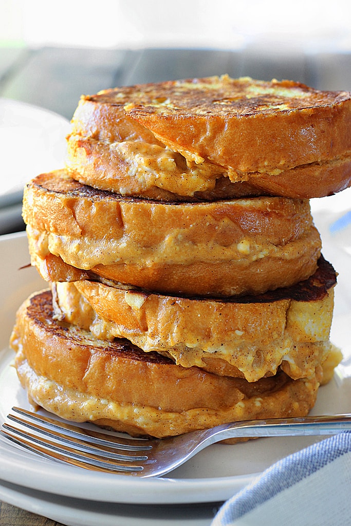 This pumpkin cream cheese french toast is a fun way to celebrate pumpkin season! With a cheesy pumpkin filling and all french toast flavors you love.
