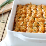 Sloppy Joe tater tots in a white casserole dish.