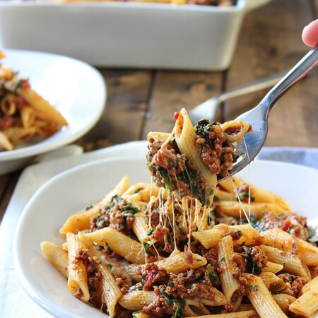 A slow cooker beef and cheese pasta that is cooked long and slow to bring out the best cheesy meat sauce!