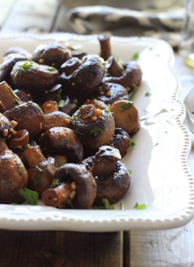 Smoky roasted mushrooms makes a great side dish to any pot roast or steak. Doused in a garlic butter sauce and seasoned with smoked paprika and parsley.