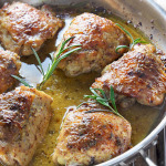 Perfectly seared and baked chicken thighs in a honey mustard sauce with hints of rosemary make this baked honey mustard chicken a great dinner.