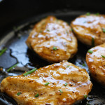 Maple glazed chicken breasts in a cast iron skillet.