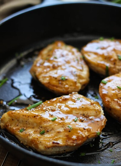 Maple glazed chicken breasts in a cast iron skillet.