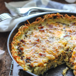 Enjoy a crispy hash brown crust in this hash brown breakfast quiche filled with custard, zucchini, mushrooms and bacon!